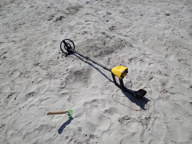 istock Metal detector on the beach. 1550123522