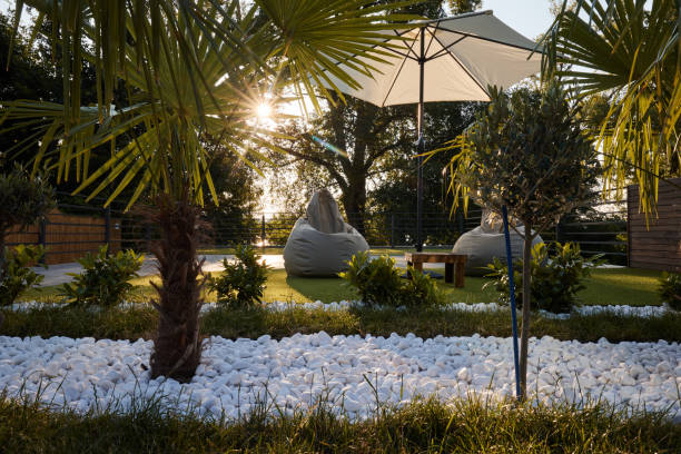 Relaxing bean bags and parasol in a modern backyard.