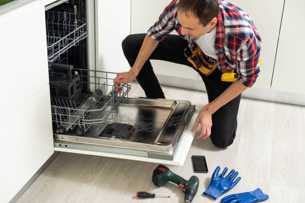 istock View Of Man In Overall Repairing Dishwasher In Kitchen 1550128331