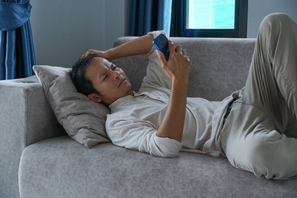 istock asian men using smart phone and feeling sad with a media data. mental distress concept. 1550132163