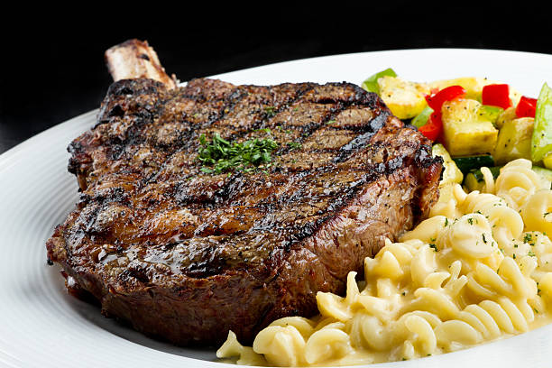 istock Rib Eye Steak with Macaroni and Cheese 155014426