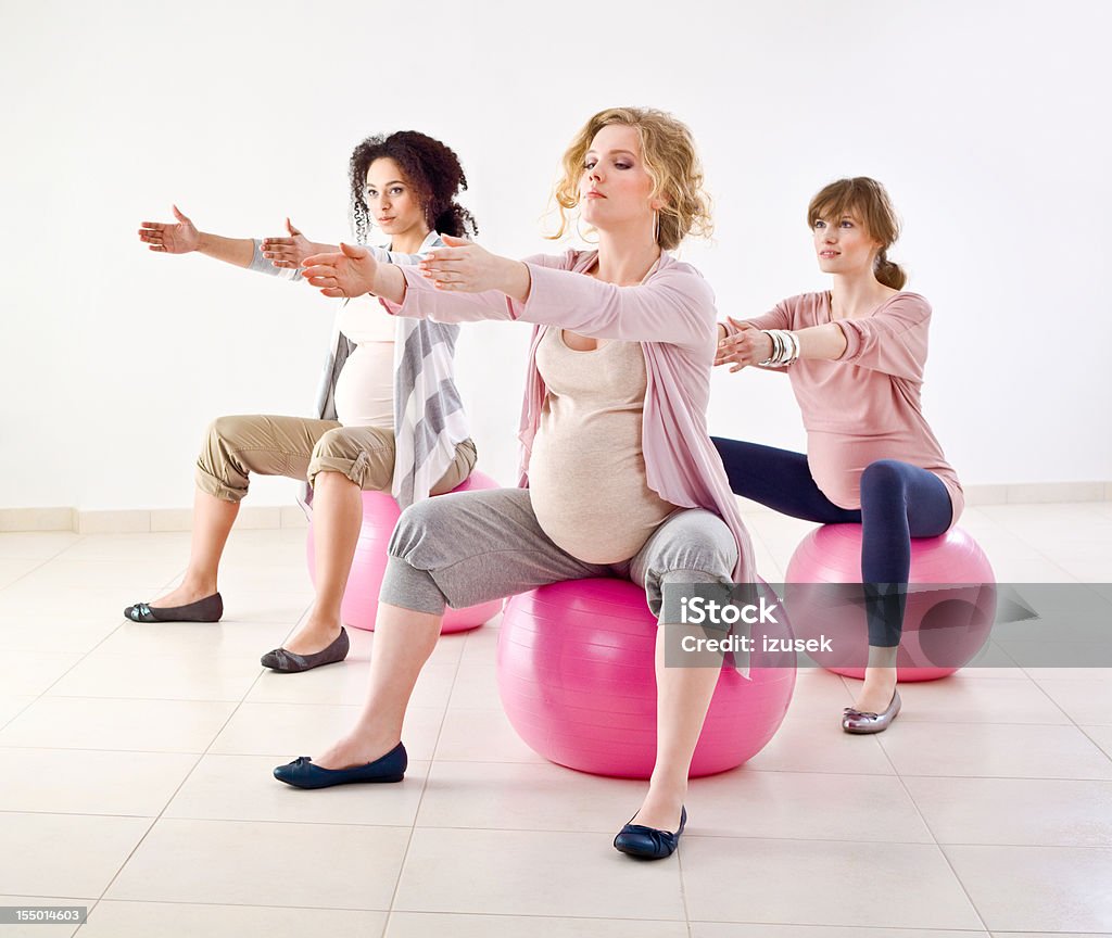 Pregnant women doing exercises  20-24 Years Stock Photo