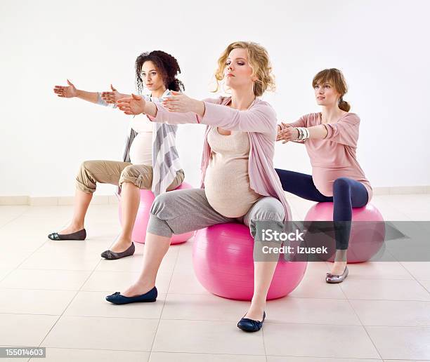 Pregnant Women Doing Exercises Stock Photo - Download Image Now - 20-24 Years, Abdomen, Adult