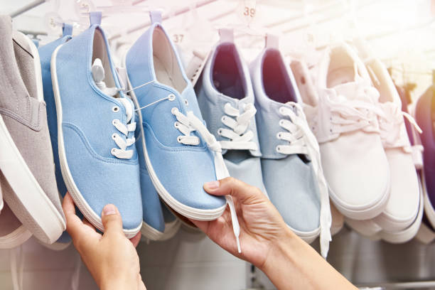 istock Buying shoes in store 1550150961