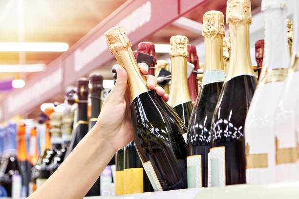istock Bottle of champagne on hands 1550152041