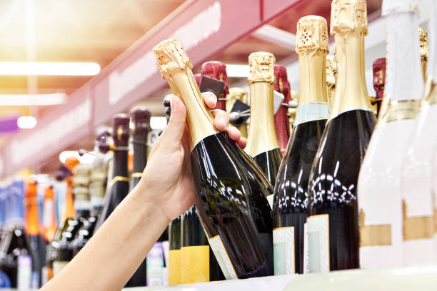 Bottle of champagne on hands stock photo