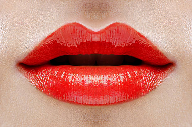 istock Close up of lips with red lipstick 155015571