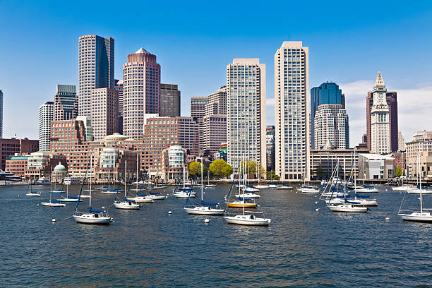 istock Boston Harbor Cityscape, Anchored Sailboats Under Blue Sky 155015591