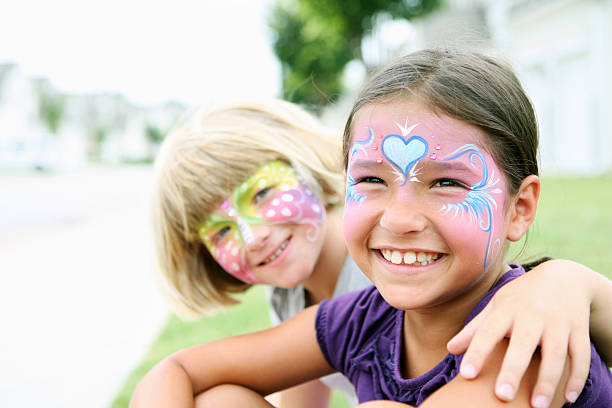 istock Happy young girls with painted faces 155015939