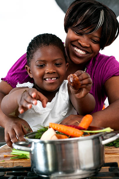 istock Mother and daugter cooking 155015974