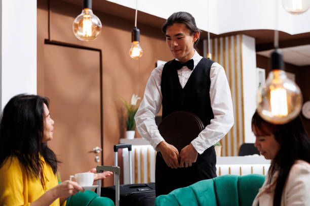 istock Woman having coffee in hotel lobby 1550160220