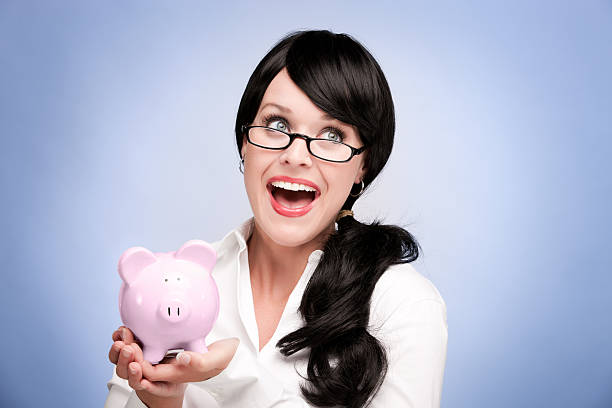 istock Happy Woman With Piggy Bank 155016342