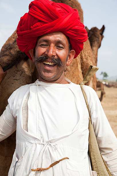 istock Happy Smiling Camel Trader At The Pushkar Fair 155017279