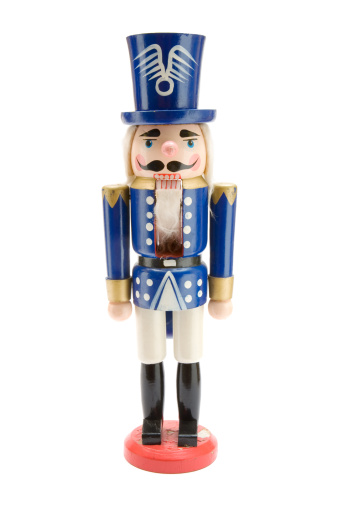 Nutcracker Christmas soldier on white background, toy figurine