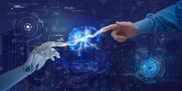 istock Hands of robot and human touch on artificial intelligence symbol. Concept of data network connection, data exchange, deep machine learning, science, artificial intelligence technology and innovation. 1550176785