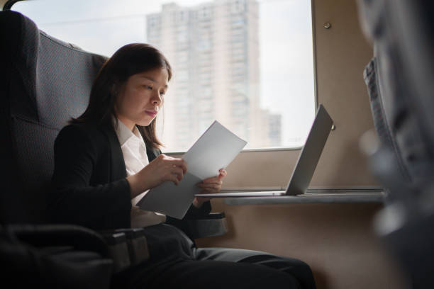 istock Female business people taking trains 1550183030