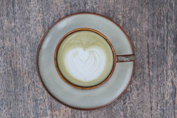 A cup of Matcha Latte with beautiful Latte Art