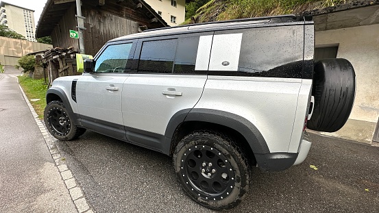 Vals, Switzerland - July, 13th - 2023: Land Rover Defender parked at a street.