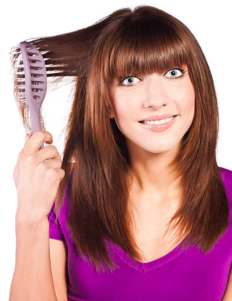 istock Attractive smiling woman brushing her hear 155027098