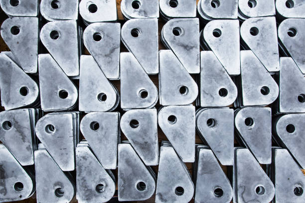 Galvanized metal products with holes for securing cargo on the deck of a cargo ship.