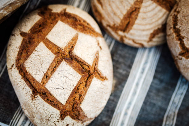 Homemade rustic breads made from spelt. Healthy bread close up photo. Wholegrain breads