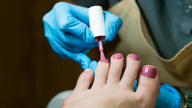 istock Pedicure. Gel polish coating 1550300284