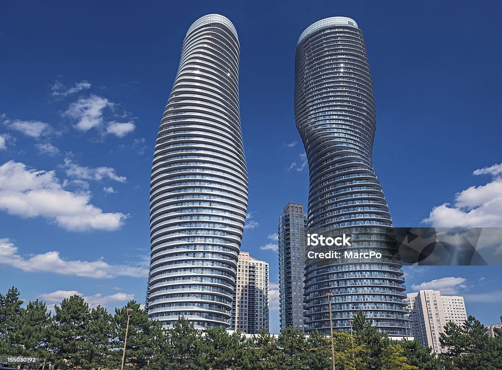 Modern condos in Mississauga, Ontario Canada The Absolute World condominium Towers in the city center of Mississauga Ontario on a sunny afternoon. The hourglass shaped tower has been nicknamed the Marilyn Monroe tower due to the curvy shape. Mississauga Stock Photo
