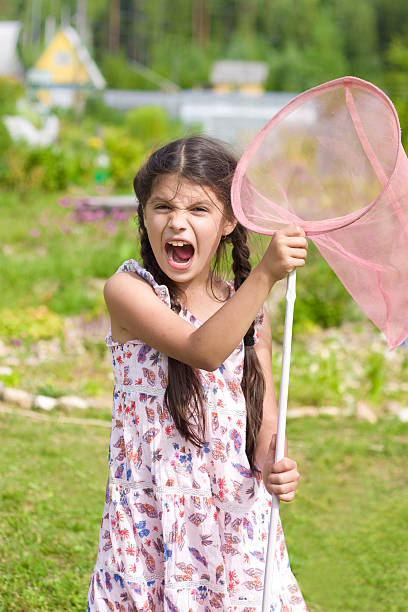 Girl with butterfly net having fun