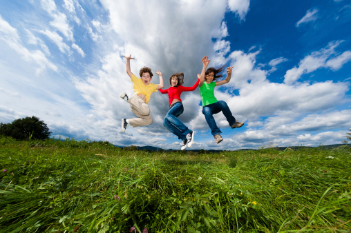 Summer joy - family jumping outdoor