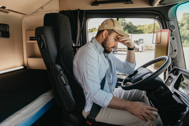 istock Tired man behind the steering wheel 1550316051