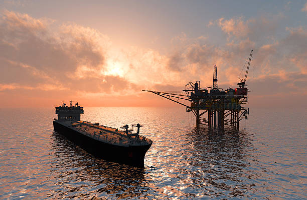 Oil Rig Oil production into the sea from above. tanker stock pictures, royalty-free photos & images