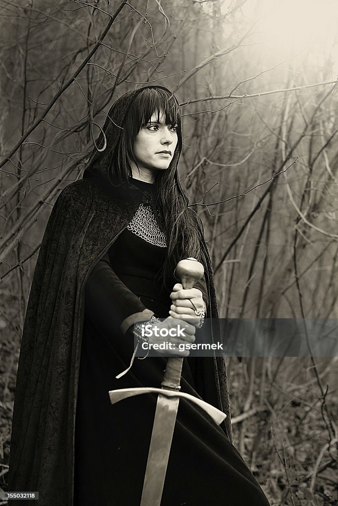 Medieval lady with sword Portrait of a medieval lady with sword (sepia toned) Cape - Garment Stock Photo