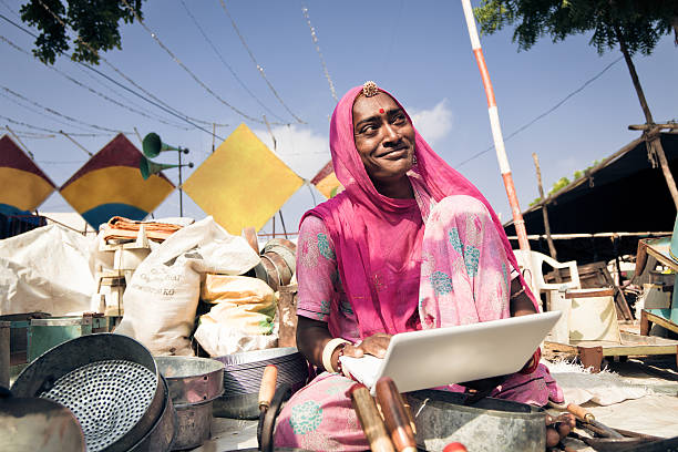 istock indian lady selling her pots on the internet 155032424
