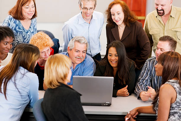 istock Large diverse group in front of a laptop 155032594