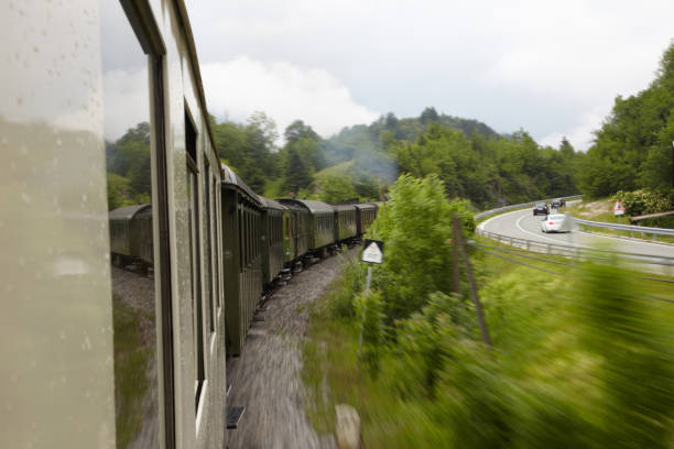 istock Old train compete with cars in curve 155032653