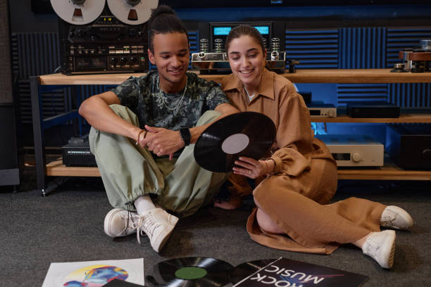 istock Smiling young couple choosing vinyl records 1550326576