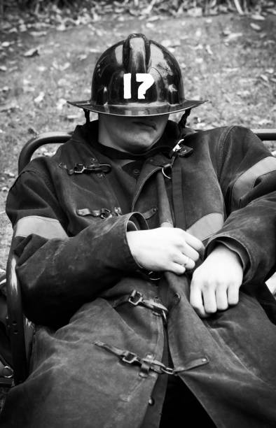 istock Firefighter Wearing Vintage Uniform Taking a Nap 155032793