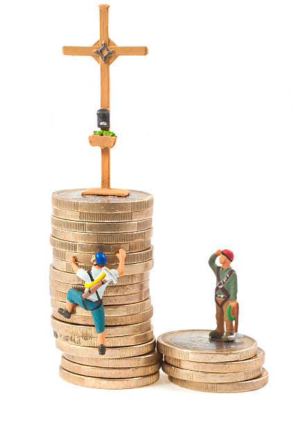 Climb on tower of money - Gipfelkreuz  figurine stock pictures, royalty-free photos & images
