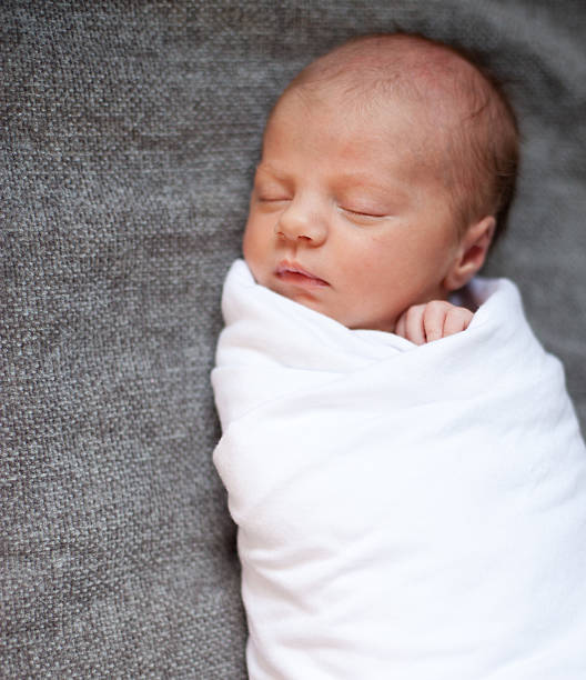 Newborn Baby on Gray Blanket stock photo