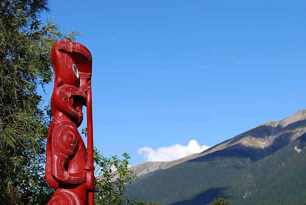 istock Maori Totem (Pou) looking out to distant Mountains 155034631
