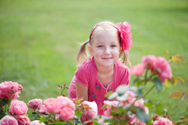 istock Little girl and roses 155034989