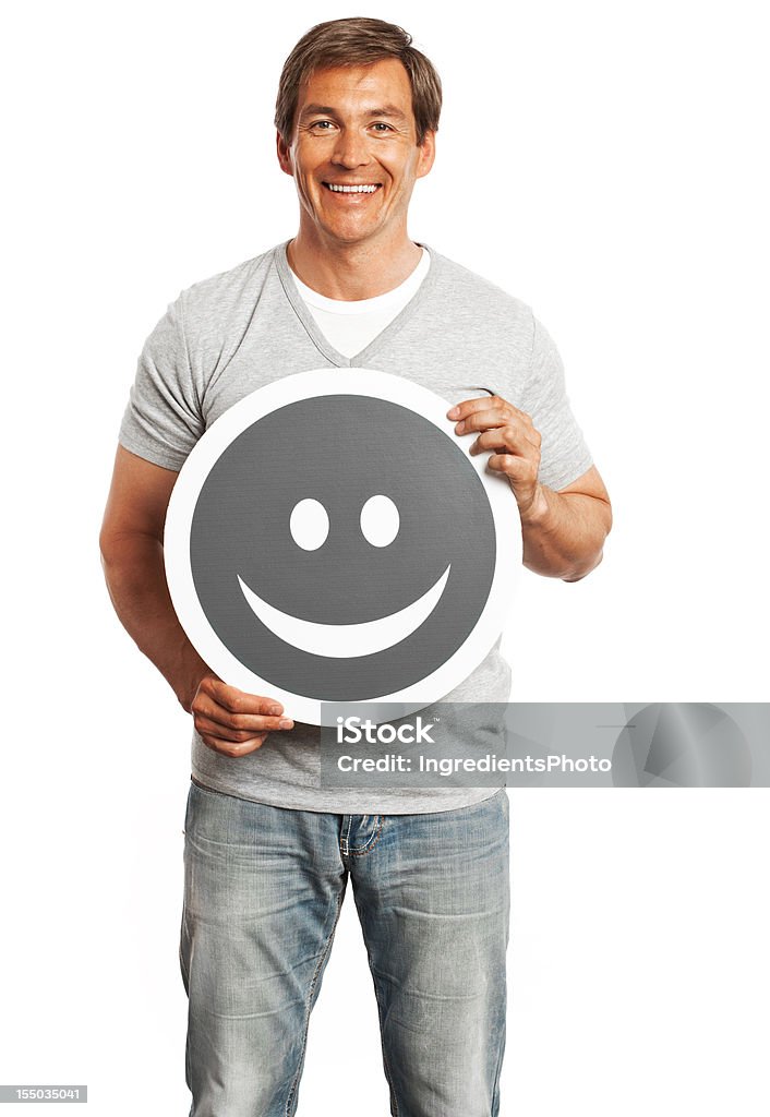 Uśmiech człowiek szczęśliwy uśmiech gospodarstwa znak na białym tle. - Zbiór zdjęć royalty-free (30-39 lat)