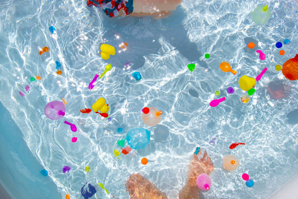 istock Pool and water balloons. 1550351681