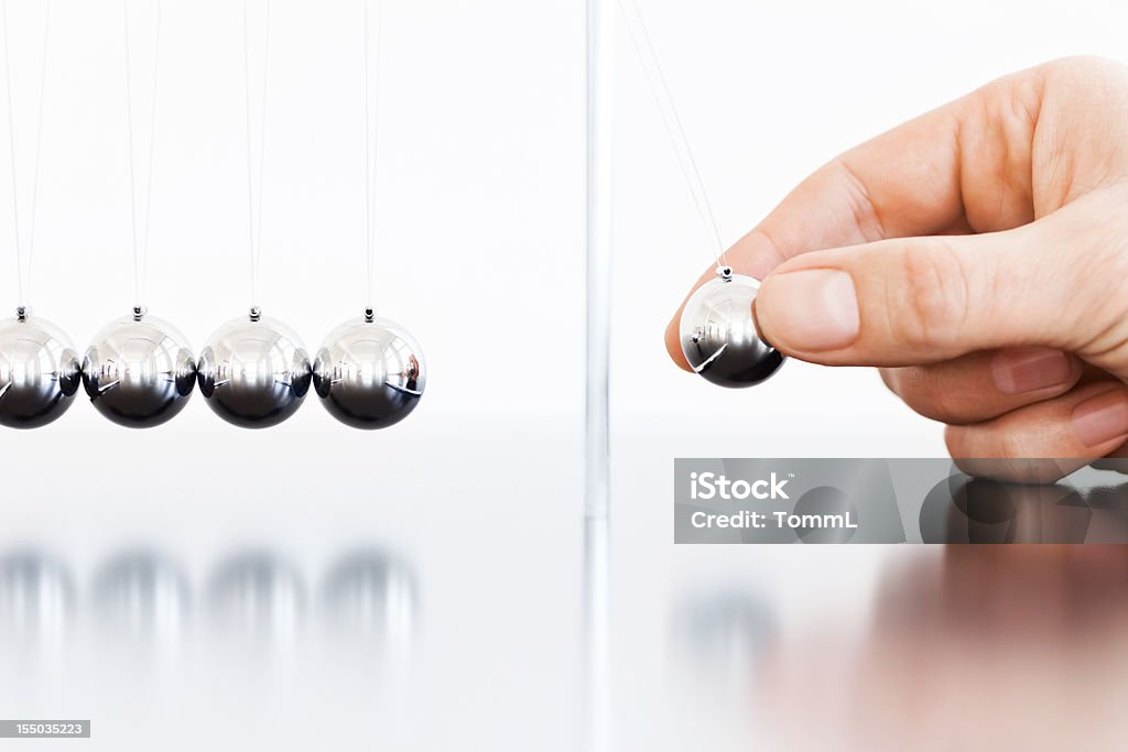 Newton's Cradle Newton's Cradle with one ball being dropped, about to set off the fascinating chain of events. Shallow DOF.

[url=/file_closeup.php?id=16305272][img]/file_thumbview_approve.php?size=1&id=16305272[/img][/url] [url=/file_closeup.php?id=16394226][img]/file_thumbview_approve.php?size=1&id=16394226[/img][/url] [url=/file_closeup.php?id=16220690][img]/file_thumbview_approve.php?size=1&id=16220690[/img][/url] 
[url=/file_closeup.php?id=16109146][img]/file_thumbview_approve.php?size=1&id=16109146[/img][/url] [url=/file_closeup.php?id=16100478][img]/file_thumbview_approve.php?size=1&id=16100478[/img][/url] [url=/file_closeup.php?id=16306632][img]/file_thumbview_approve.php?size=1&id=16306632[/img][/url] 
[url=/file_closeup.php?id=16146217][img]/file_thumbview_approve.php?size=1&id=16146217[/img][/url] [url=/file_closeup.php?id=16143401][img]/file_thumbview_approve.php?size=1&id=16143401[/img][/url] [url=/file_closeup.php?id=16418572][img]/file_thumbview_approve.php?size=1&id=16418572[/img][/url]

[url=http://www.istockphoto.com/search/lightbox/4533651/?refnum=TommL][img]http://www.zweig-industries.de/bilder/lightbox-istock/concepts.jpg[/img][/url] Newton's Cradle Stock Photo