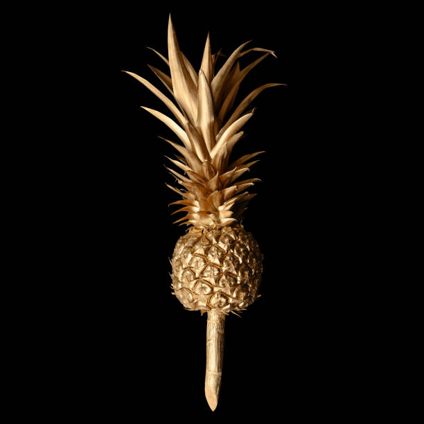 istock golden pineapple on black background.clipping path 1550356615