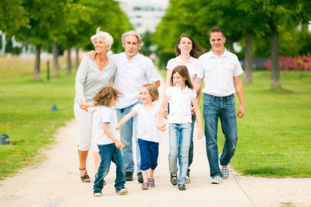 istock big family walking through the park 155035999
