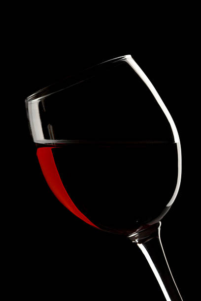 istock Elegant red wine glass in a black background 155036330