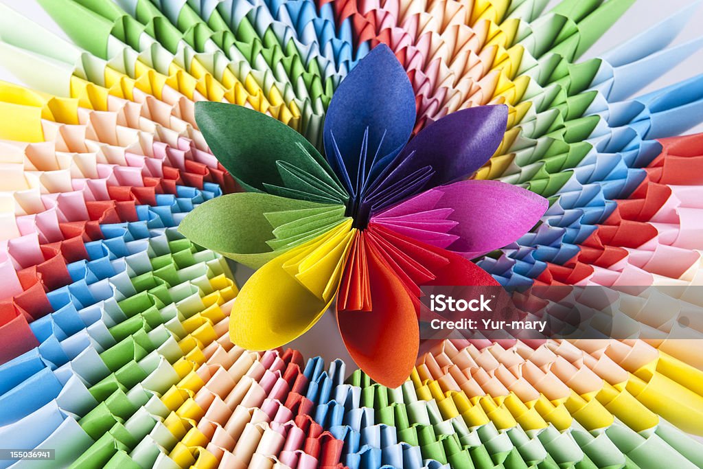 colorful flower for kusudama, on modular origami as a rainbow colorful flower for kusudama, on the bright modular origami as a rainbow. Variegated bright background Origami Stock Photo