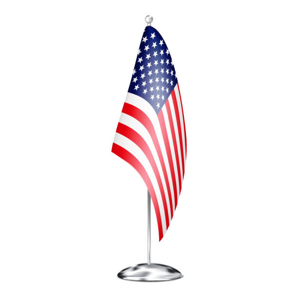 istock Fabric table flag of USA on metal pole stand isolated on white background. Office desk small US American banner. Realistic vector illustration 1550371055