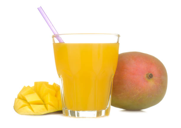 istock Ripe fresh mango fruit and mango juice in a glass on a white isolated background. tropical fruit 1550377402